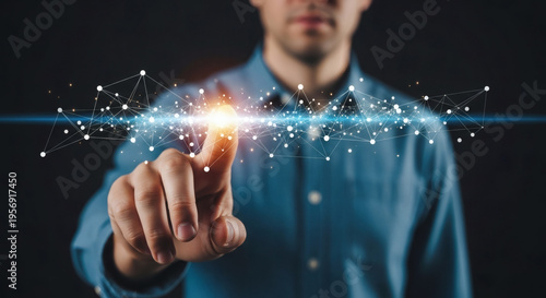 Abstract digital network connection in front of a person's pointing finger against a dark background, representing technology and innovation