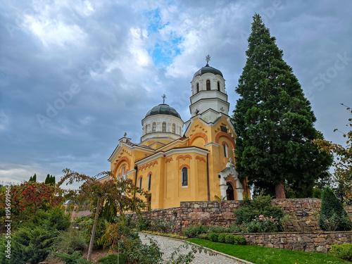 Fotografie Orthodox church with domes and garden landscape in Bulgaria