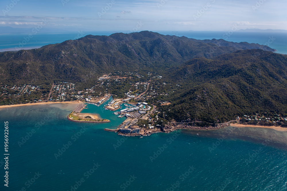 Obraz premium Nelly Bay aerial view of marina, coastline and mountains on Magnetic Island