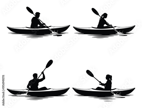 Silhouettes of people kayaking on water