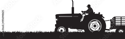 Tractor driving through a field with a trailer attached