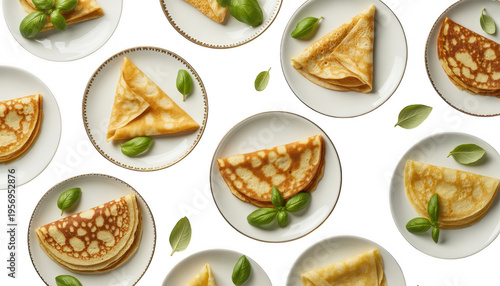 Wallpaper Mural Various crepes and pancakes on white plates with basil leaves isolated on a transparent background Torontodigital.ca
