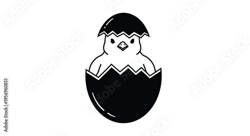 Baby chick emerging from an eggshell a striking black silhouette