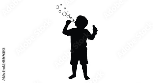 Child blowing bubbles outdoors a striking black silhouette