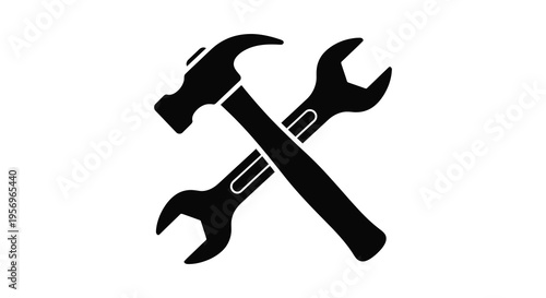 Crossed hammer and wrench tools presented as a dark silhouette