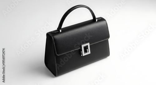Sleek and sophisticated black leather handbag, a timeless accessory with a modern silver clasp, perfect for professional settings or elegant evening wear