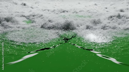 Wallpaper Mural A green liquid surface with white foam erupting above, with a dark background Torontodigital.ca