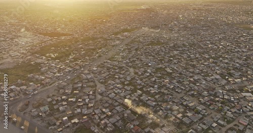 Cape Town South Africa Aerial v102 birds eye view flyover Baden Powell Dr capturing views of Khayelitsha Township and Japhta K Masemola Rd at sunset - Shot with Mavic 3 Pro Cine - Jan 11th 2024