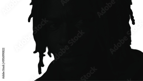 Close up silhouette of a young man with dreadlocks looking directly forward against a white background.