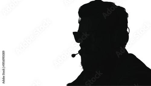 Silhouette of a male customer service representative wearing a headset with a microphone positioned near the.