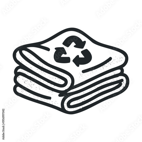 Recycled textiles stack featuring a universal symbol of environmental protection and sustainability, representing eco-friendly practices in the clothing industry.