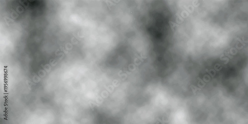 Abstract motion of white smoke and gray steam swirling against a dark black background to create a moody mist texture with a cloud of light