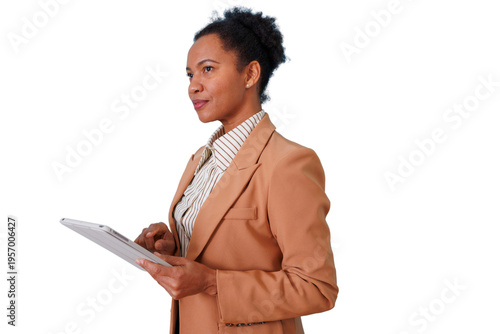 Black businesswoman using a tablet, working with technology, standing in profile on a transparent background