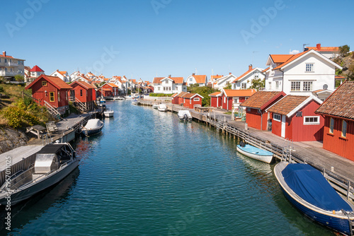 Harbour canal with boats and waterfront houses in Grundsund, Skaftö island, Bohuslän archipelago, west coast of Sweden