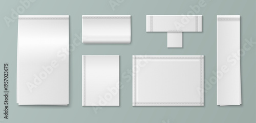 White fabric label mockup with realistic woven texture. Blank cotton tag sewn on cloth garment with detailed stitching, vector set isolated on background. Brand identity and apparel design product