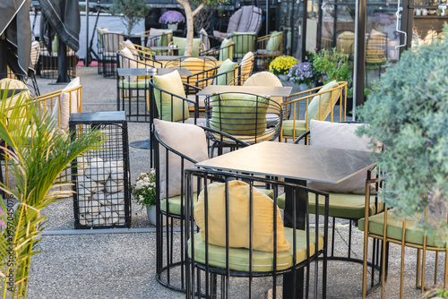 Charming Street Cafe with Cozy Patio Seating in a Vibrant Urban Setting