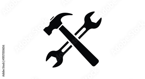 Crossed tools including hammer and wrench in stark silhouette