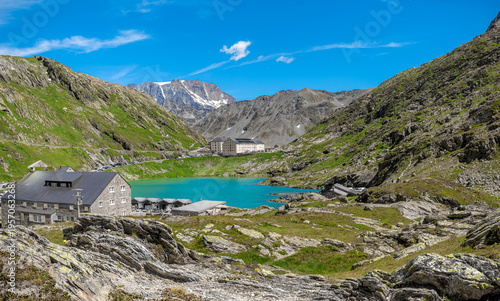 Panorama of a small alpine lake surrounded by the mountains at the Great St Bernard Pass in Italy.