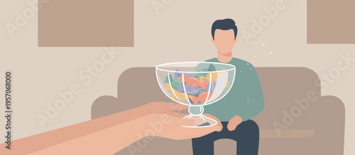 Man sitting on a couch receiving a bowl of colorful snacks  