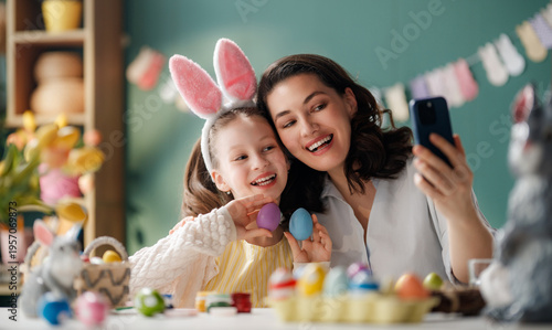 Happy Mother and Daughter Taking Easter Selfie Together While De