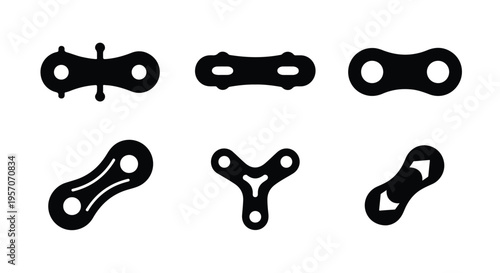 Flat lay of six different bicycle chain link designs on a white background in a minimalist style with a focus on industrial details.