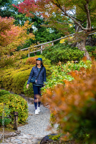 Portrait of Young Caucasian Woman Wearing Navy Clothing and Cap at Yoshikien Garden Nara