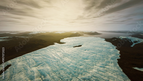 Canvas-taulu Aerial glacier expanse under golden sky revealing icy textures, scattered floes