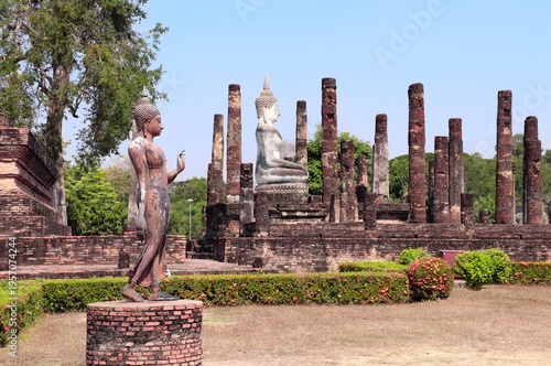Obraz na płótnie Ancient stone Buddha statue and ruins of ancient temple Wat Tra Phang So, Sukhothai historical park