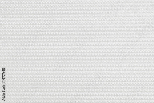 Fotografie Embossed cardstock background, uniform raised paper pattern