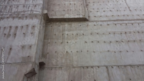Concrete wall with texture showing unique design elements, patterns, and construction details in an urban environment for architectural use