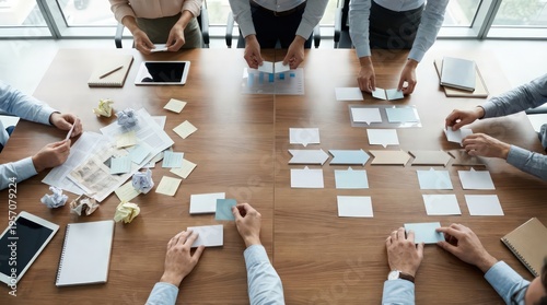 Overhead corporate strategy reset workshop with team hands turning messy paperwork into a clean roadmap using modular cards in a modern office