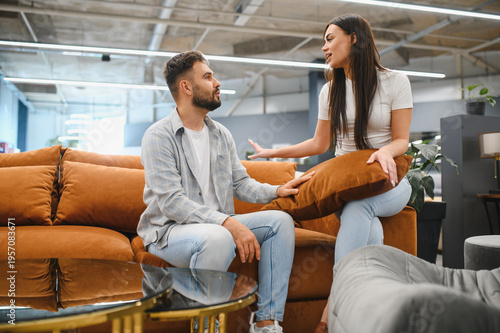 Photos Couple arguing buying furniture at home store