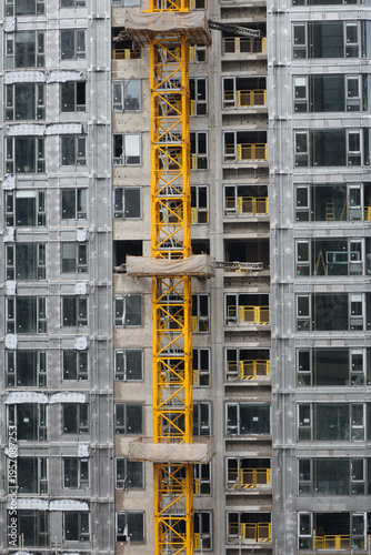 Vertical image of the construction process of a multi-story building