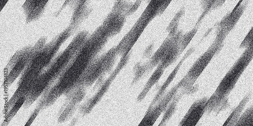 Abstract grayscale diagonal streaks with granular noise and blurred edges creating a dynamic textured background for creative design and digital art projects