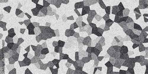 Abstract grayscale mosaic pattern with granular texture and irregular polygonal shapes creating a textured background for design and digital art applications