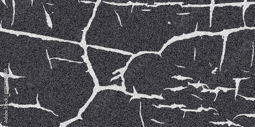 Cracked asphalt texture with white fissures and a dark granular surface creating a distressed and weathered abstract background for grunge and urban design themes