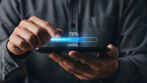 Person's hands are holding a black smartphone displaying a digital loading bar with 