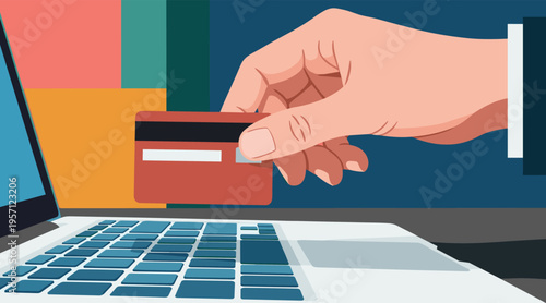 Hand holding credit card over laptop keyboard during online checkout