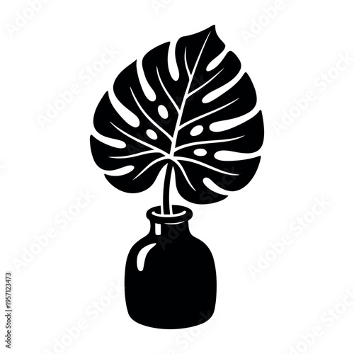 Monstera leaf tropical plant staying in a vase with simple black and white silhouette creating a modern botanical icon