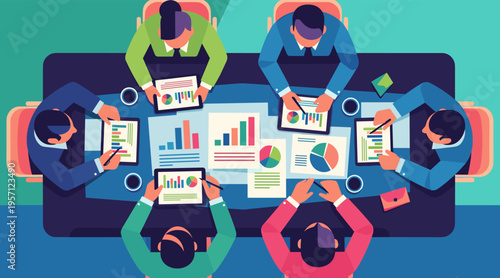 Team reviewing charts around table during collaborative meeting session