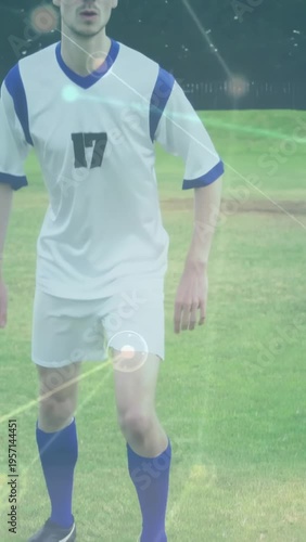 Vertical video: Soccer player reading play, planting foot, swinging to clear, falling, green HUDs