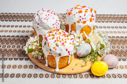 Traditional Easter cakes decorated with icing, dried fruits, seeds, and flowers