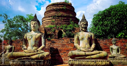 Photos Row of ancient Buddha statues wearing saffron robes at Wat Yai Chai Mongkhon tem