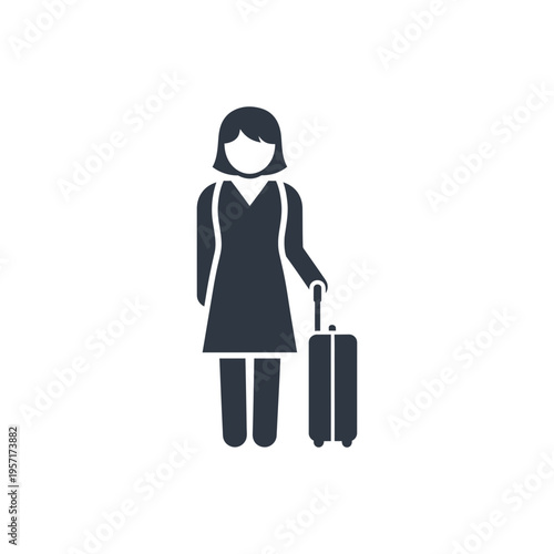 Female traveler with a suitcase standing upright, holding the handle with one hand.