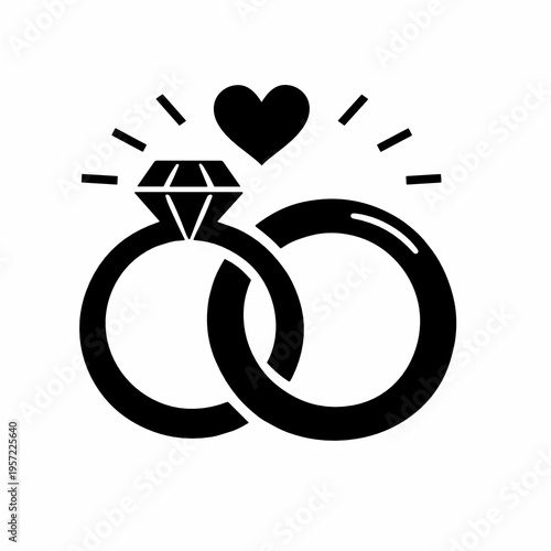 Black and white interlocked wedding rings with diamond and heart accent. Marriage symbol icon for engagement announcements, bridal invitations and romantic branding design.