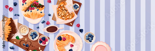 horizontal frame with a summer picnic backdrop. A blanket in the park, snacks, baked goods, and beautiful tableware. A top view. A cozy outdoor party with food in the backyard and field. Friends