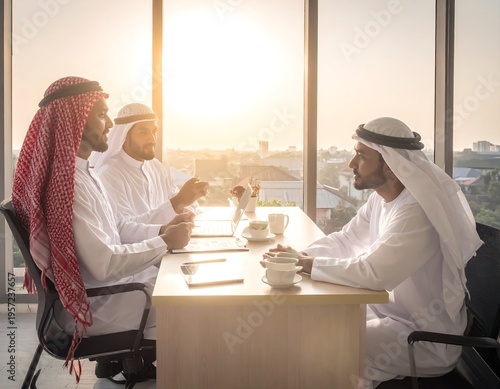 Three men in white robes confer during a meeting