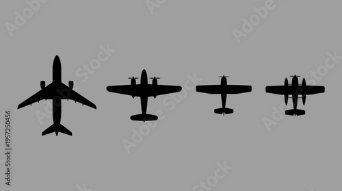 Silhouettes of four different types of airplanes, ranging from a large passenger jet to smaller propeller aircraft, against a plain grey background.
