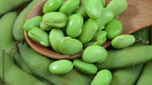 Edamame soy beans in wooden spoon.
