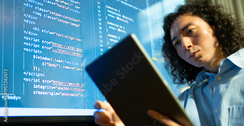 Obraz na plátne code analyst using big display, software developer focused on debugging with ext